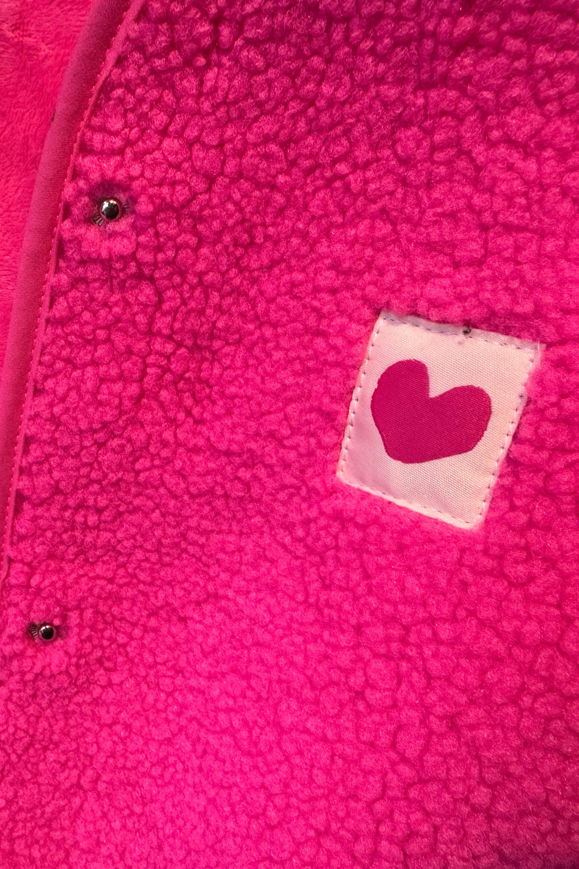 Gilet sans manches rose coeur